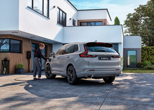 26YM_CR-V_PHEV_Urban_Grey_Rear_Charging_Villa_with_Talent.jpg